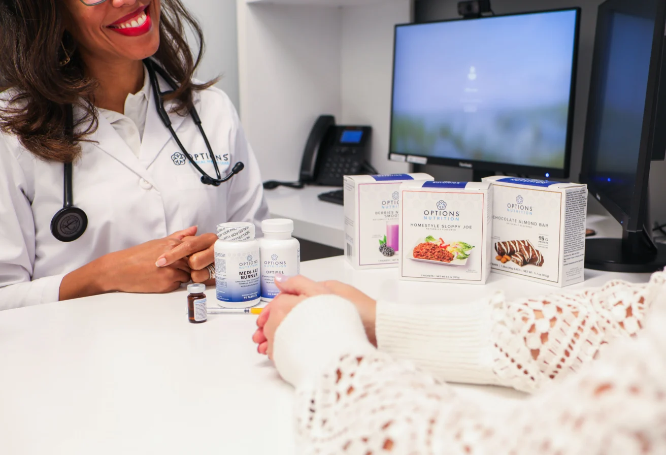 A consultation between a doctor and patient at Options Medical.